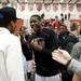 Milan senior CJ Turnage celebrates with friends after defeating Chelsea 71-40 on Friday. Daniel Brenner I AnnArbor.com